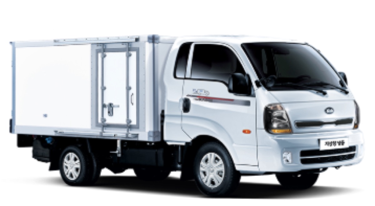 A small refrigerated box truck with white insulated body panels, seen from the front quarter
