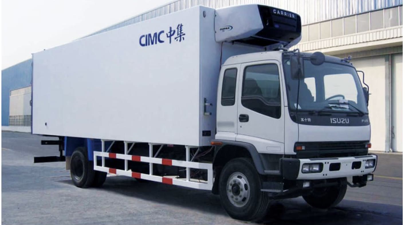 A white refrigerated box truck with its cooling unit above the cab